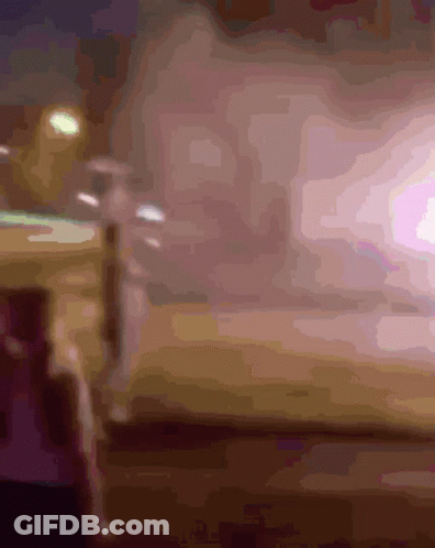 Blurry Person Standing In Front Of Light GIF