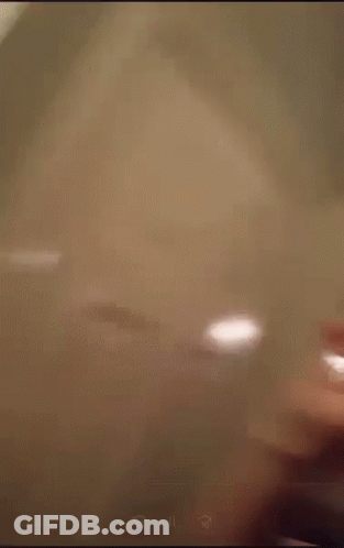 Blurry Person Standing In Front Of Microwave Oven GIF
