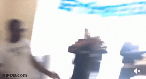 Blurry Person Standing In Front Of Window With Sound Icon GIF