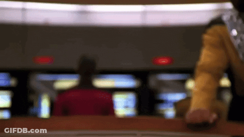 Blurry Person Standing In Red Light Room GIF