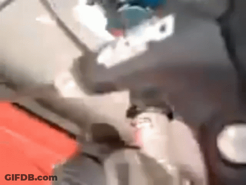 Blurry Person Standing On Red Surface GIF