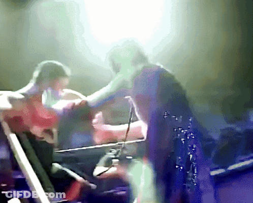 Blurry Person Standing On Stage GIF