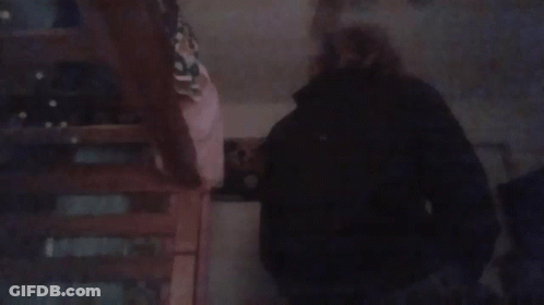 Blurry Person Standing On Staircase GIF