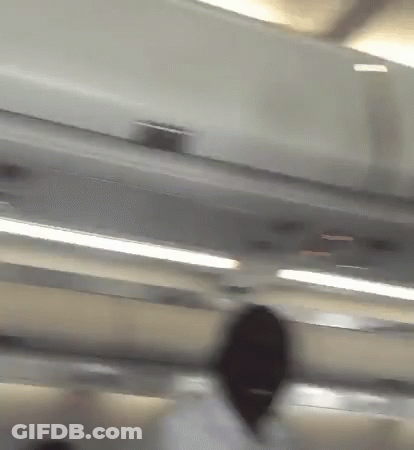 Blurry Person Standing Under Ceiling GIF