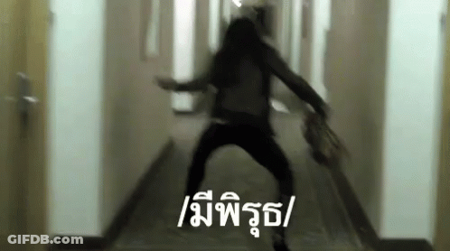 Blurry Person Walking Down Hallway With Chinese Writing GIF