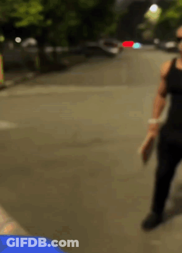 Blurry Person Walking Down Street GIF
