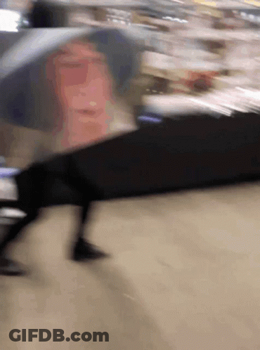 Blurry Person Walking Down Street GIF