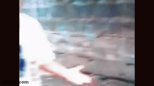 Blurry Person Walking On Sidewalk GIF