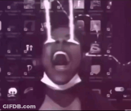 Blurry Person Wearing Mask And Bow Tie GIF