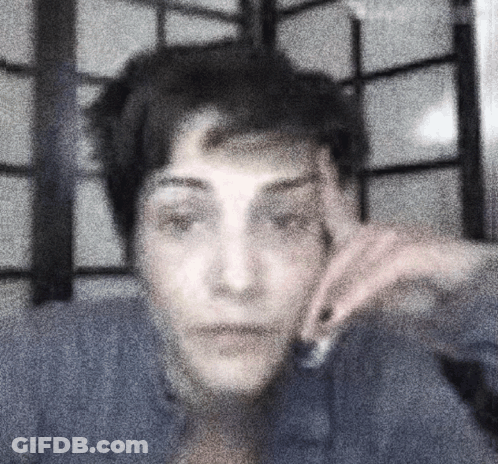 Blurry Person With Hand On Face GIF