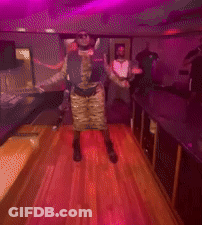 Blurry Photo Group Dancing Under Purple Lights GIF