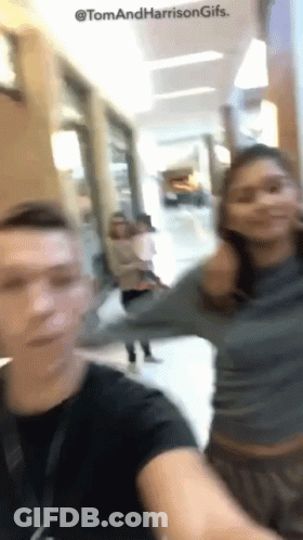 Blurry Photo Of Man And Woman Tom And Harrison GIF