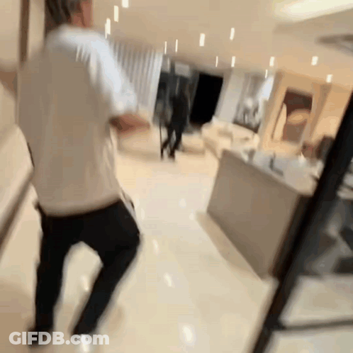 Blurry Photo Of Man Dancing In Living Room GIF