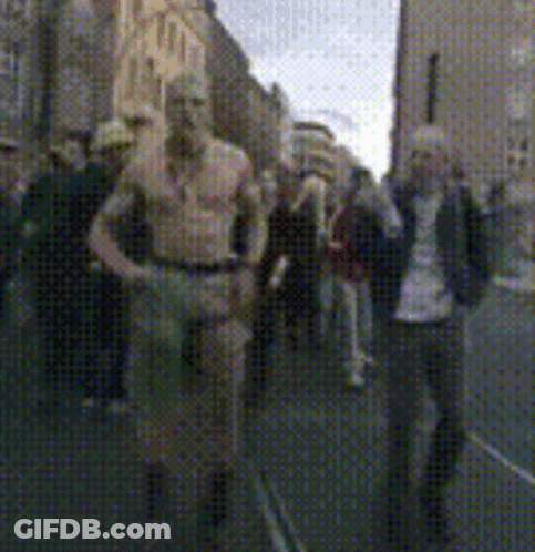 Blurry Photo Of People Walking Down Street GIF