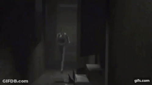 Blurry Picture Of Woman's Face In Dark Room GIF