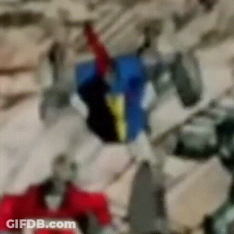 Blurry Robot With Red Blue And Yellow Stripe On Chest GIF