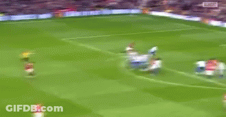 Blurry Soccer Game Players In Red GIF