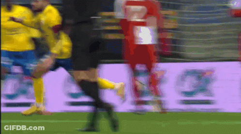 Blurry Soccer Game With Purple Allianz Banner GIF