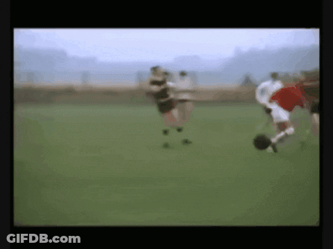 Blurry Soccer Game With Red Player GIF