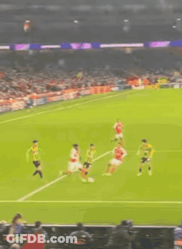 Blurry Soccer Game With Yellow Flag GIF