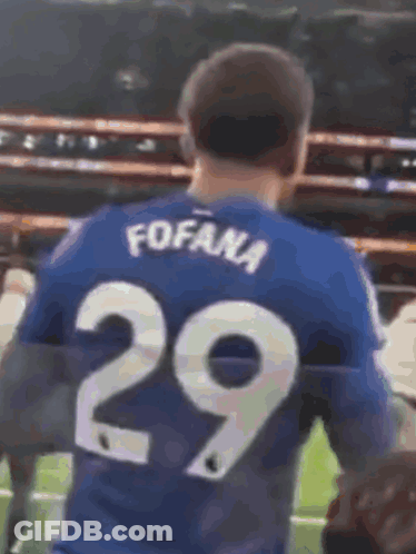 Blurry Soccer Game With Yellow Sign GIF