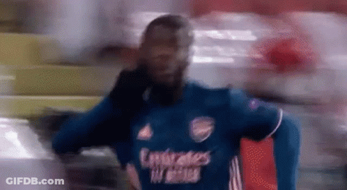 Blurry Soccer Player In Blue Emirates Shirt GIF