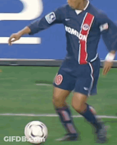 Blurry Soccer Player Kicking Soccer Ball GIF