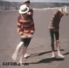 Blurry Two People Dancing On Beach GIF