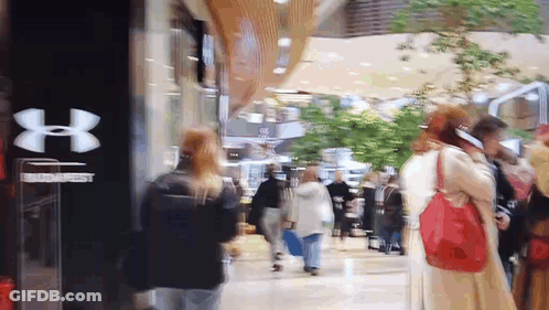 Blurry Under Armour Store With People Walking GIF