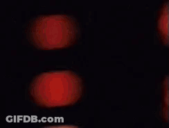 Blurry Woman And Man Face In Dark Room GIF