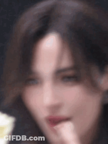 Blurry Woman Face Hand To Mouth GIF