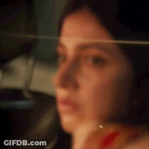 Blurry Woman Face With Glass GIF