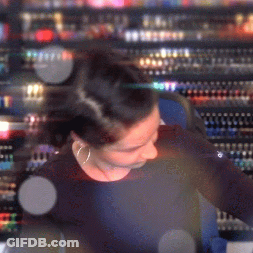 Blurry Woman In Black Shirt With Word Champion GIF