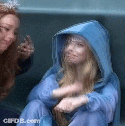 Blurry Woman In Blue Hooded Jacket GIF