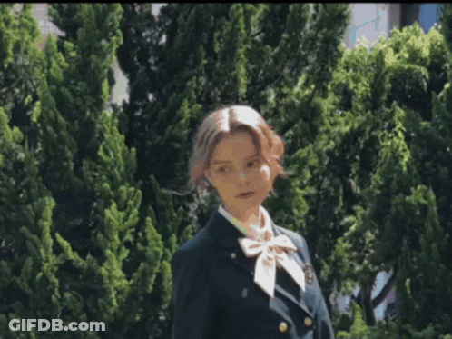 Blurry Woman In Green Dress GIF