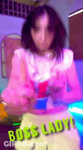 Blurry Woman In Pink Top Saying Boss Lady GIF