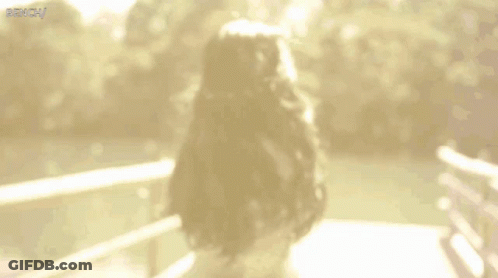 Blurry Woman On Bridge Saying Bench GIF