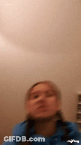 Blurry Woman's Face With Nose Bandage GIF