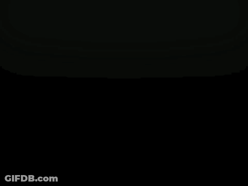 Blurry Woman Standing Next To Man Statue GIF