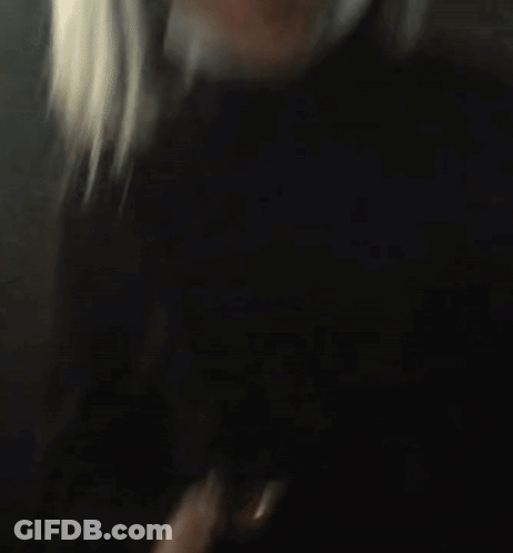 Blurry Woman With Long Blonde Hair GIF