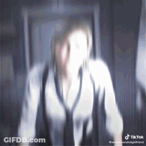 Blurry Woman With TikTok Watermark GIF