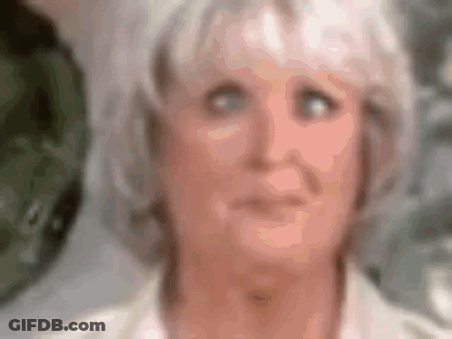 Blurry Woman With White Hair And Blue Eyes GIF