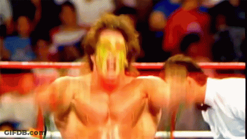 Blurry Wrestler In Yellow Mask GIF