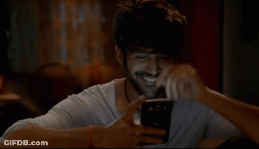 Blushing Guy Timid Texting GIF