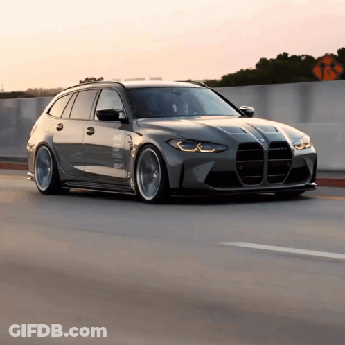 BMW Driving Down Highway With No Left Turns Sign GIF