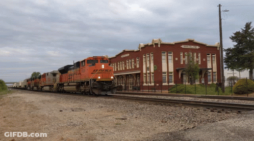 BNSF Train Pulling Up To Railroad Station GIF