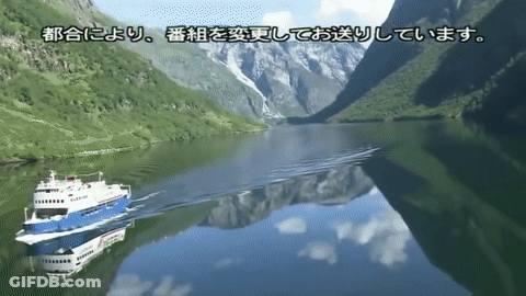 Boat On Lake With Mountains GIF