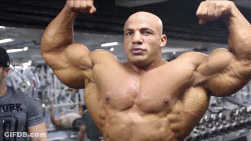 Bodybuilder Flexing Muscles In Work Shirt GIF