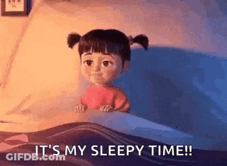 Boo From Monsters Inc Is Sitting In A Bed With The Words `` It 'S My Sleepy Time '' . GIF