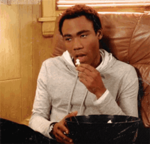 Bored While Eating Popcorn GIF
